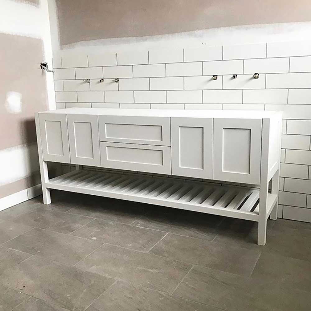 Bathroom: White shaker style vanity with slatted shelf