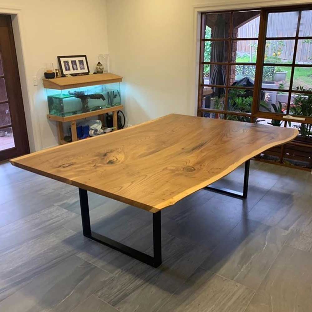 Table: English elm slab dining table with metal legs